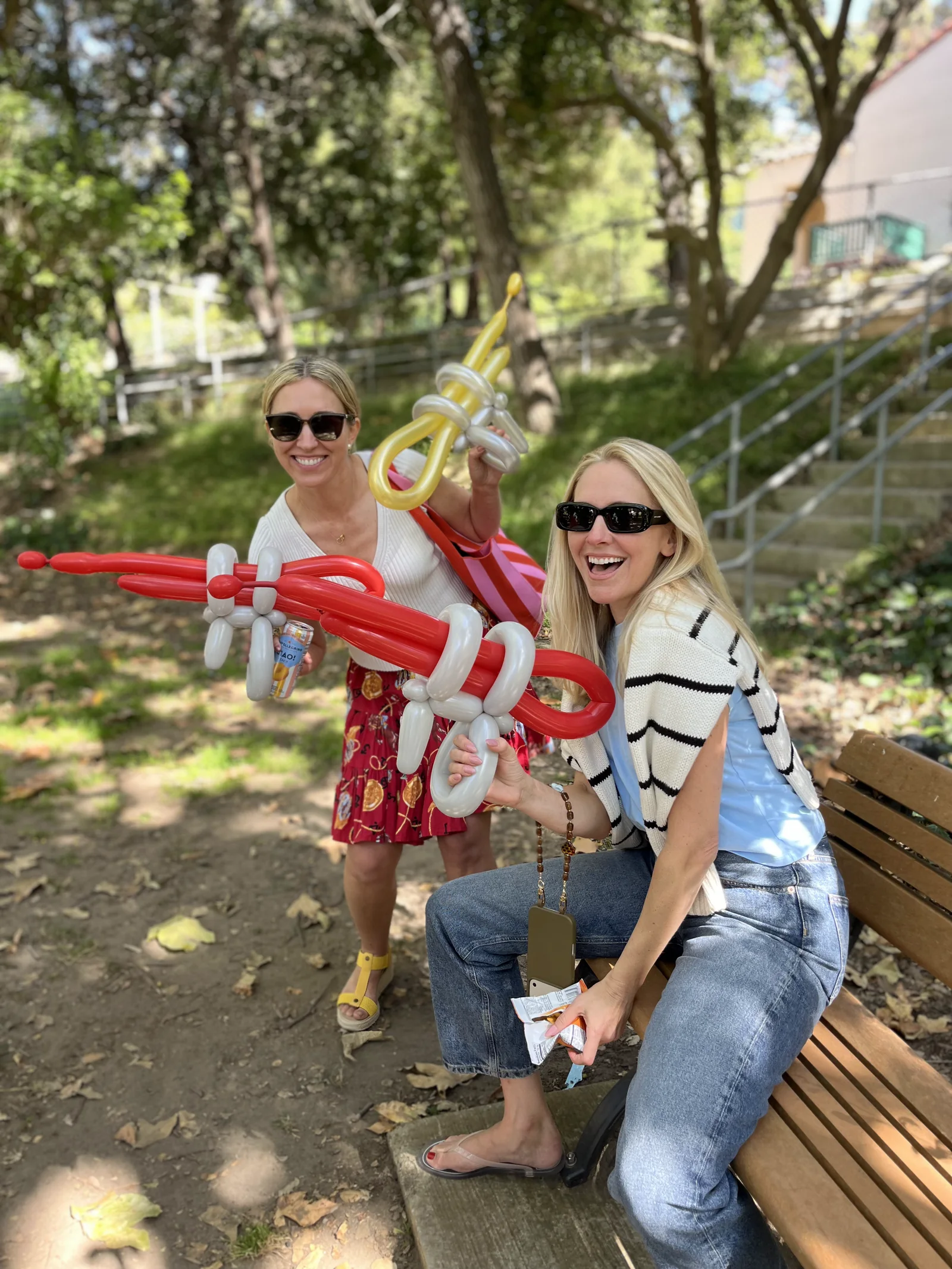 Red balloon sword at an outdoor party by Happy Faces LA