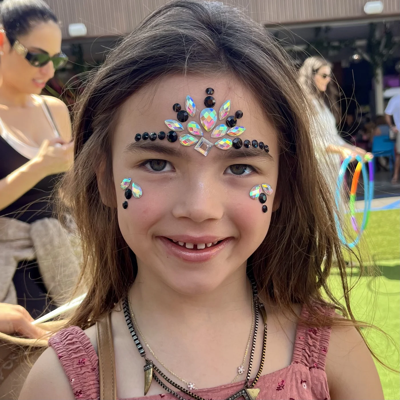 Face gems and crystal jewelry at a birthday party in Los Angeles by Happy Faces LA