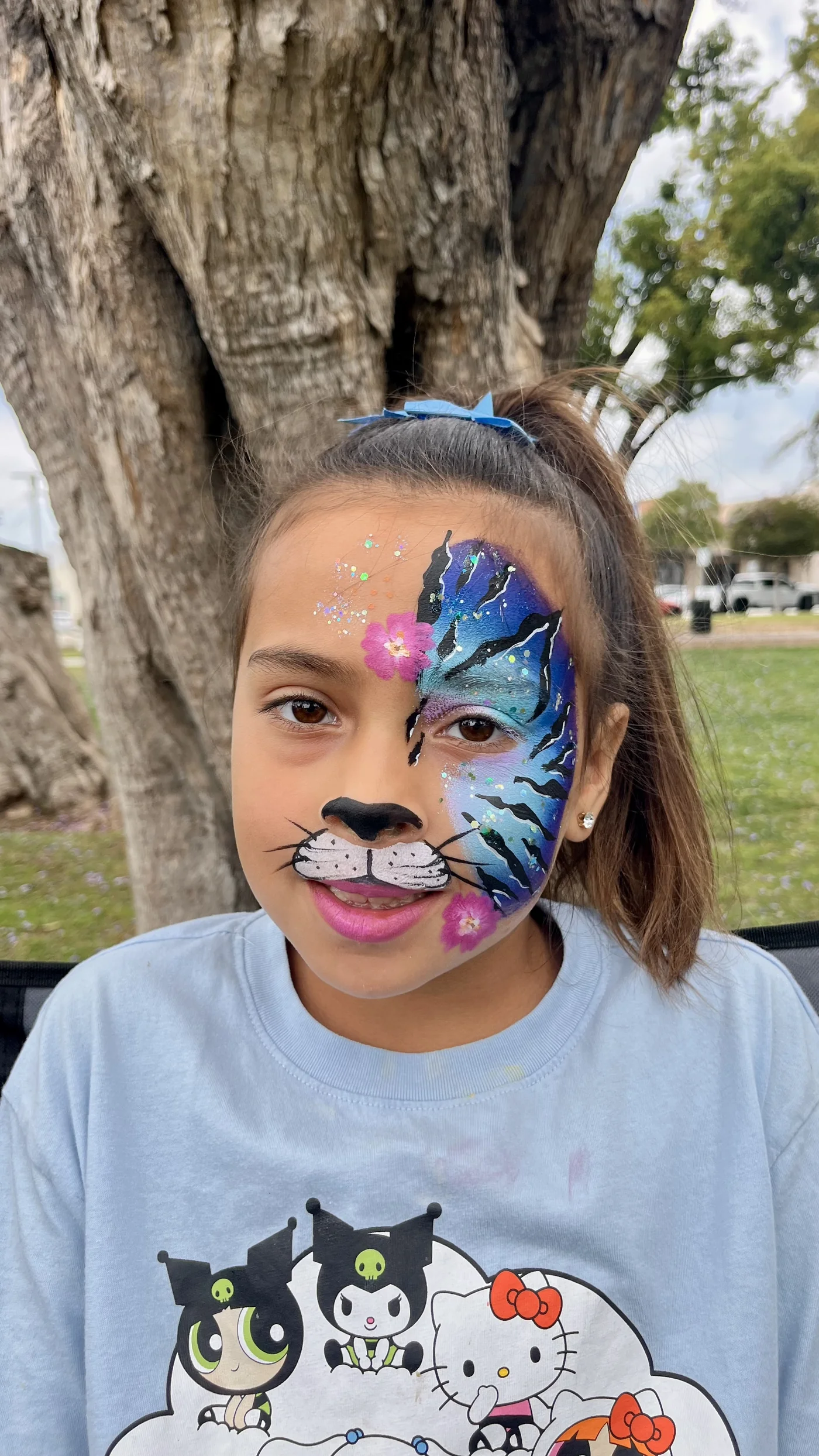 Half cat, half galaxy butterfly face painting by Happy Faces LA in Los Angeles