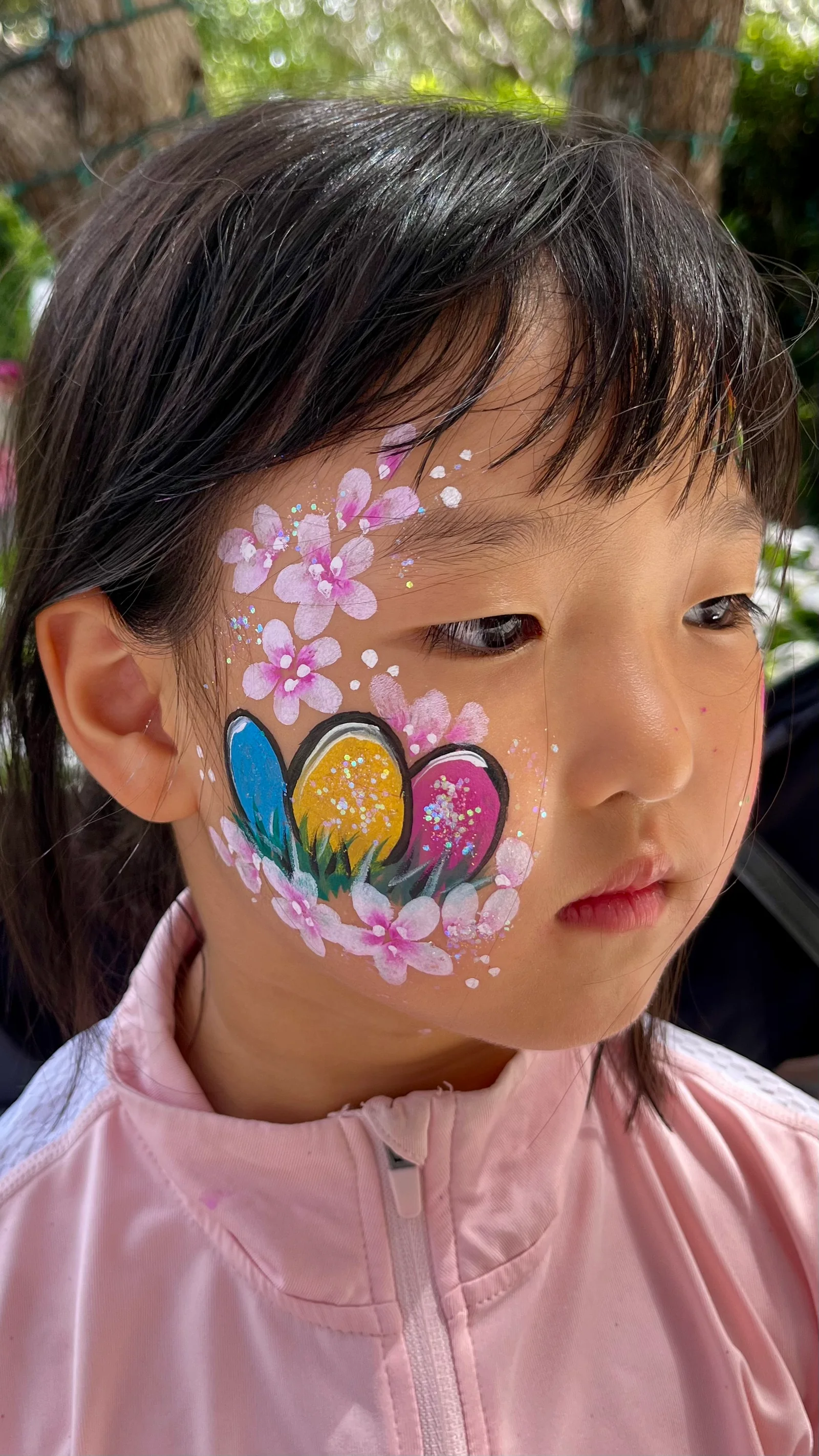 Easter egg and cherry blossom cheek face painting by Happy Faces LA