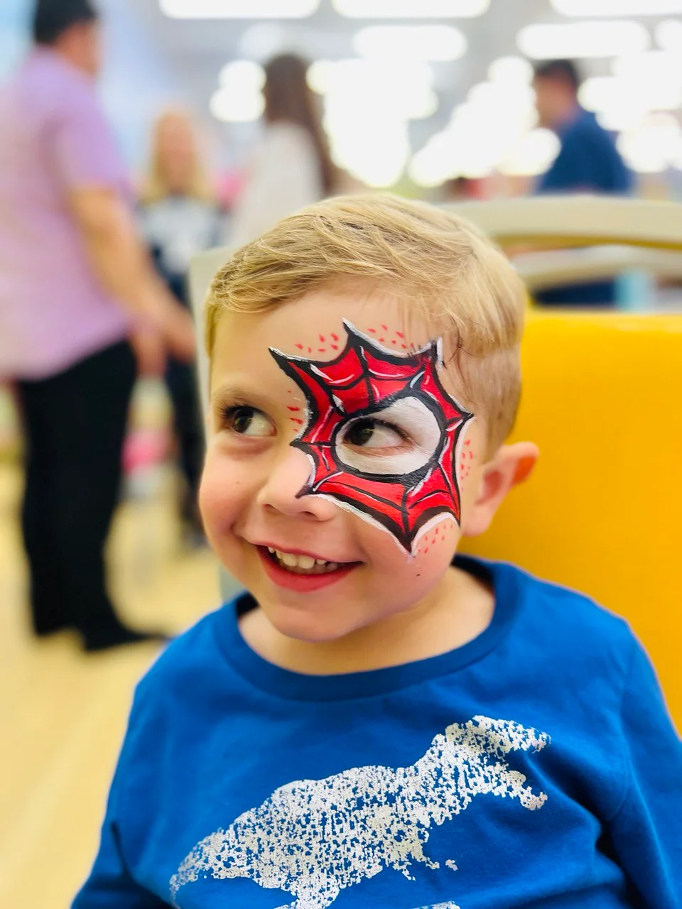 Superhero web eye cheek face painting by Happy Faces LA