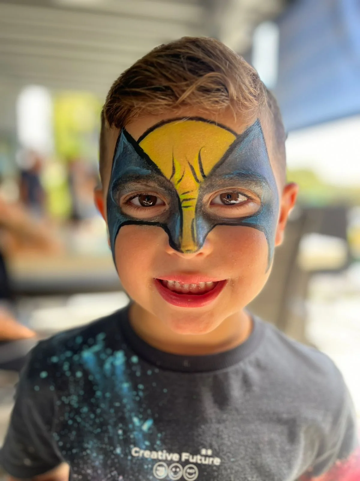 Yellow superhero mask full face painting by Happy Faces LA