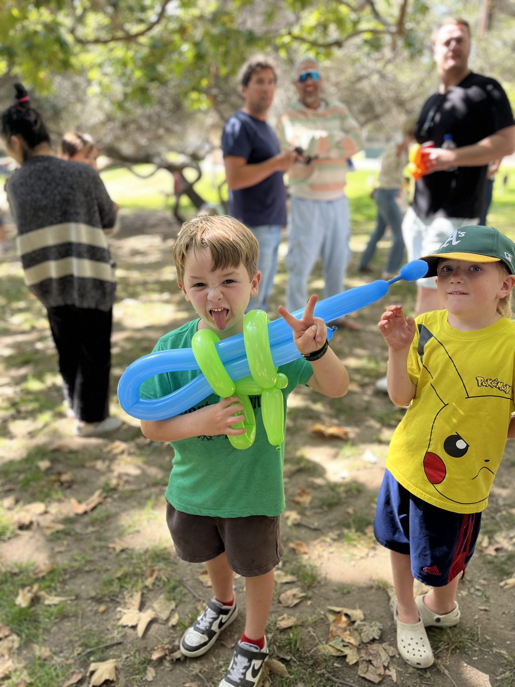 Green and Blue Balloon Swords by Happy Faces LA.