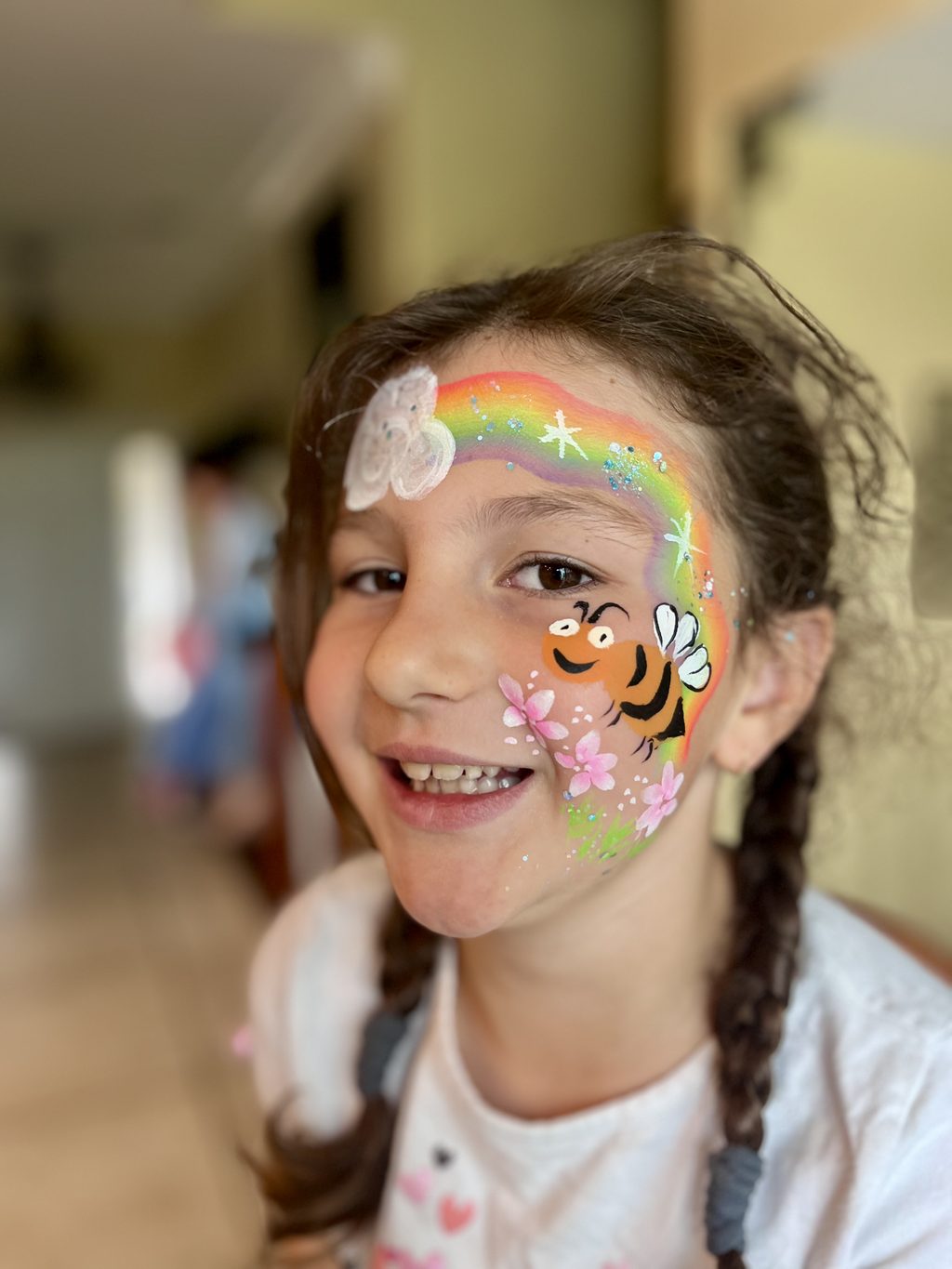 Honeybee with Rainbow and Flowers by Happy Faces LA.