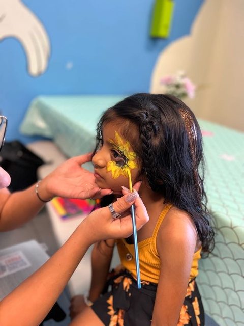 Rainbow Butterfly Eye Design with Glitter by Happy Faces LA.