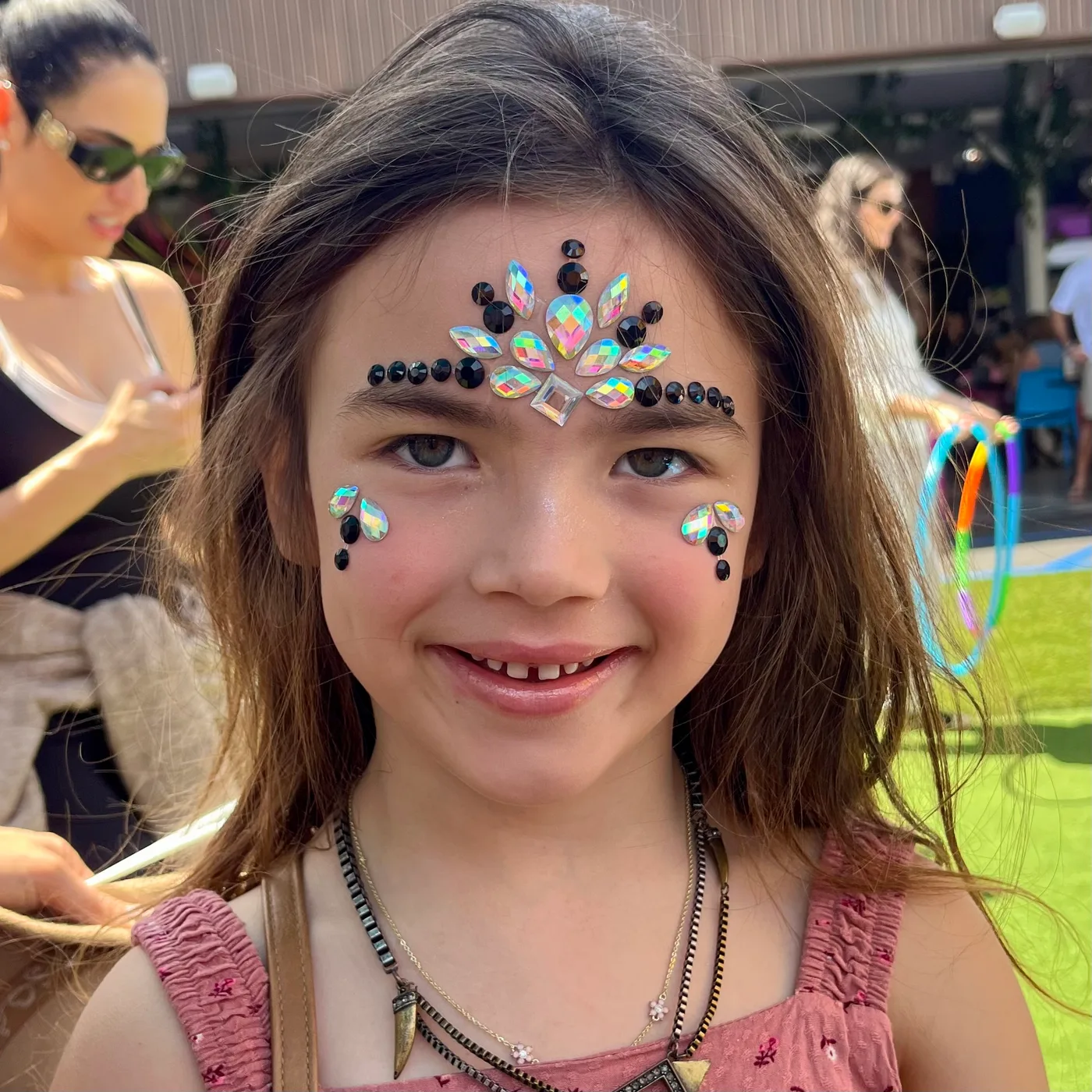 Face gems and crystal jewelry applied by Happy Faces LA at a birthday party